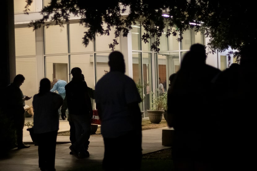 People wait to hear about loved ones outside of the SSGT Willie de Leon Civic Center where...