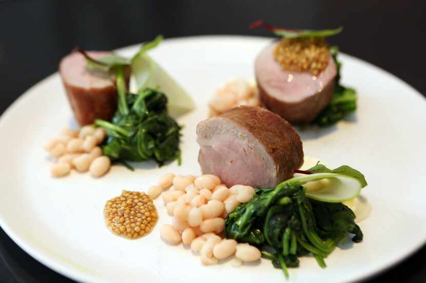 Cafe Momentum's pork loin with cider beans and pickled mustard seeds