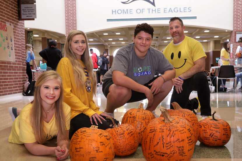 From left, Hope Squad members McKinley Bownds, Brooke McBride, Grehson Coates and teacher...