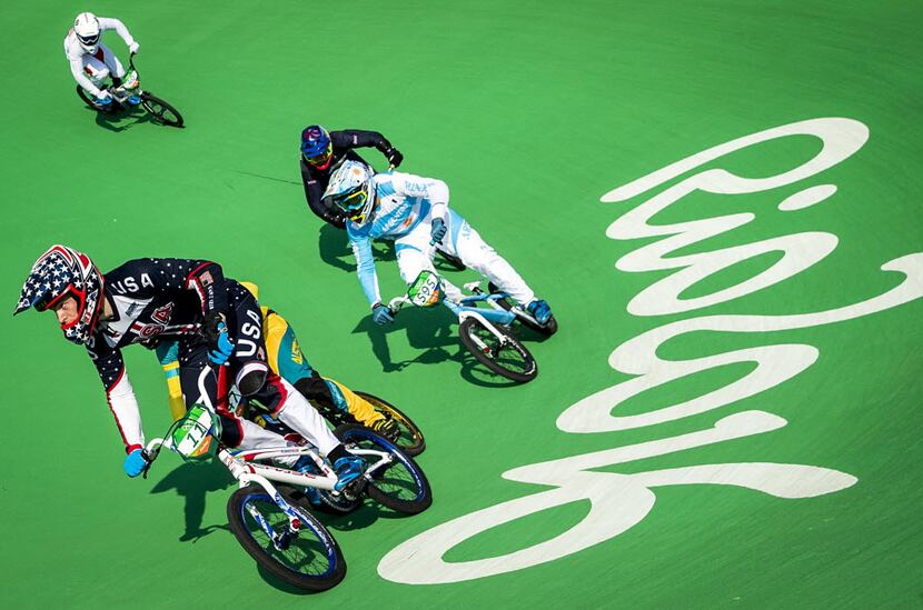 FILE - Connor Fields of the United States leads a racers around a turn during men's BMX...