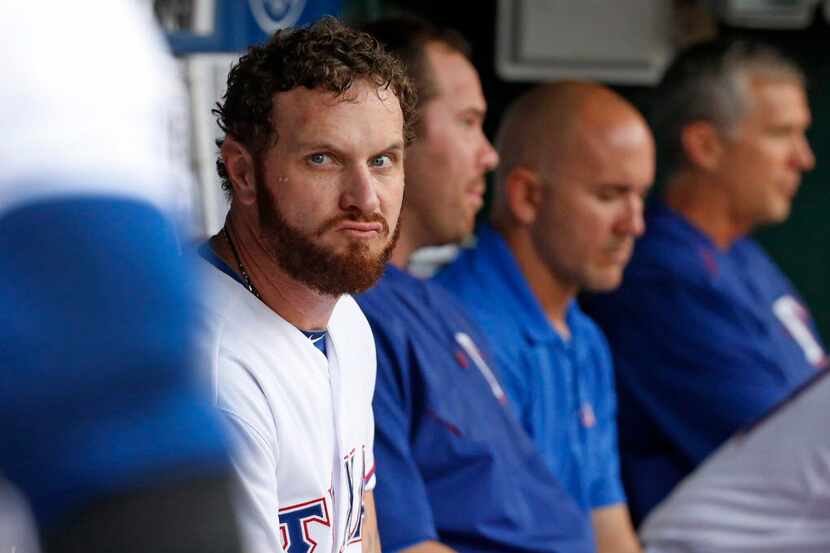 Texas Rangers left fielder Josh Hamilton (32) is pictured in the dugout during the Boston...