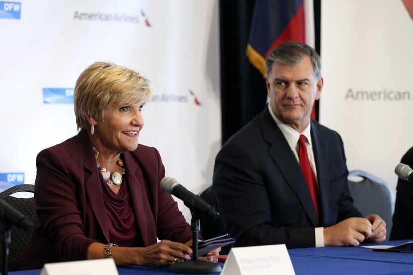 Fort Worth Mayor Betsy Price speaks as Dallas Mayor Mike Rawlings listens during a news...