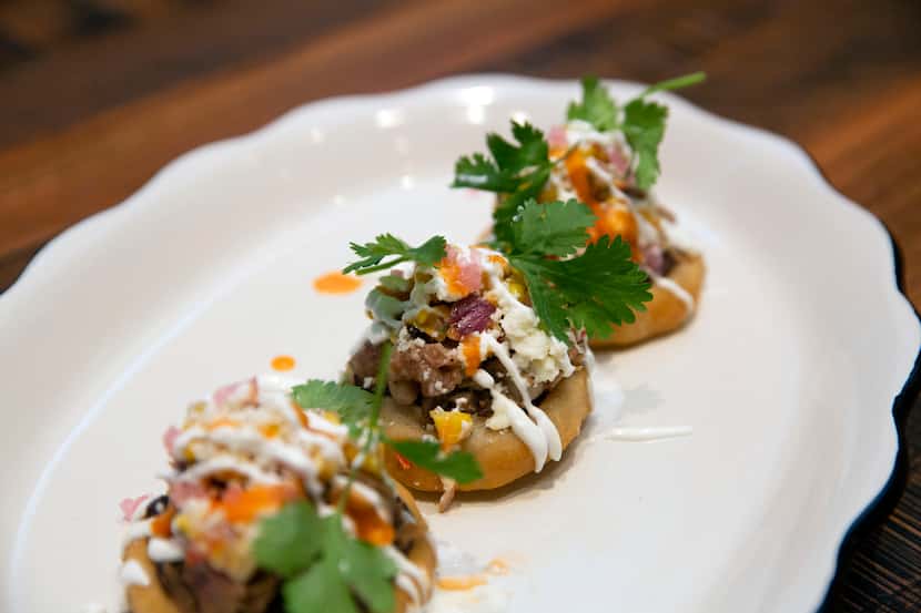 Sopes are given a Texas spin with a filling of smoked brisket, black beans, lime crema,...
