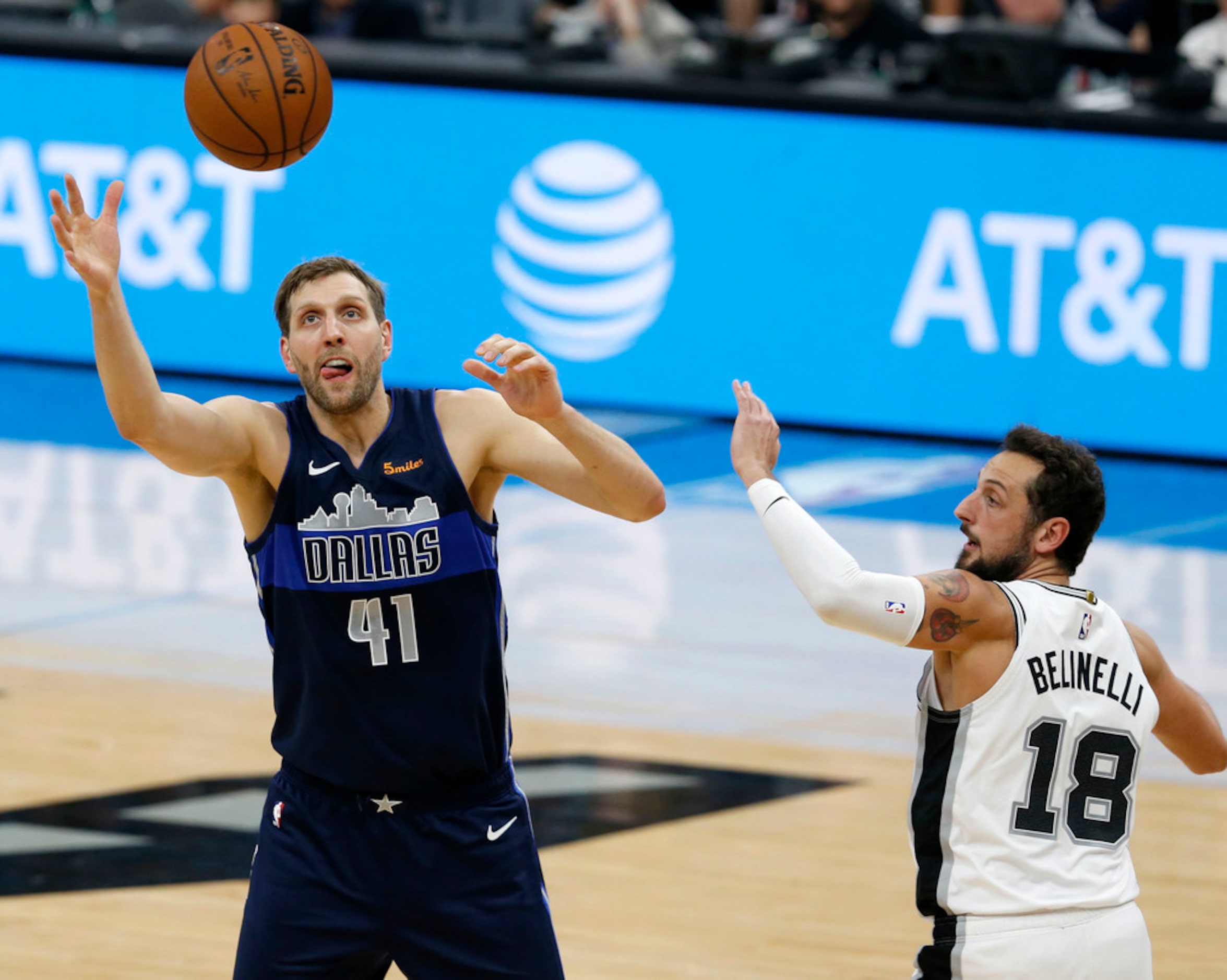 Dallas Mavericks forward Dirk Nowitzki (41) grabs for the ball against San Antonio Spurs...