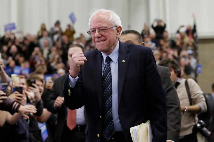  Democratic presidential candidate, Sen. Bernie Sanders, I-Vt, pumps his fist as he arrives...
