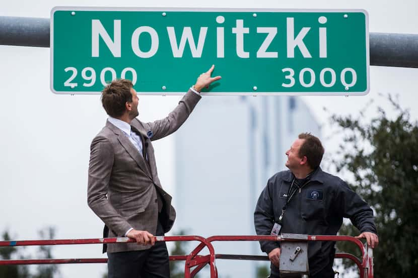 Retired Dallas Mavericks player Dirk Nowitzki unveils a street sign with his name on Oct....