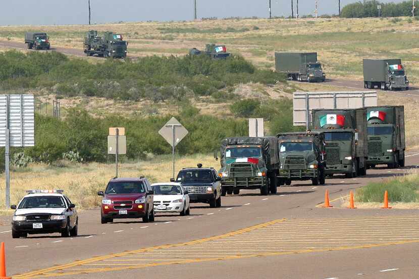 Texas Department of Public Safety troopers and Army personnel escorted a convoy of Mexican...