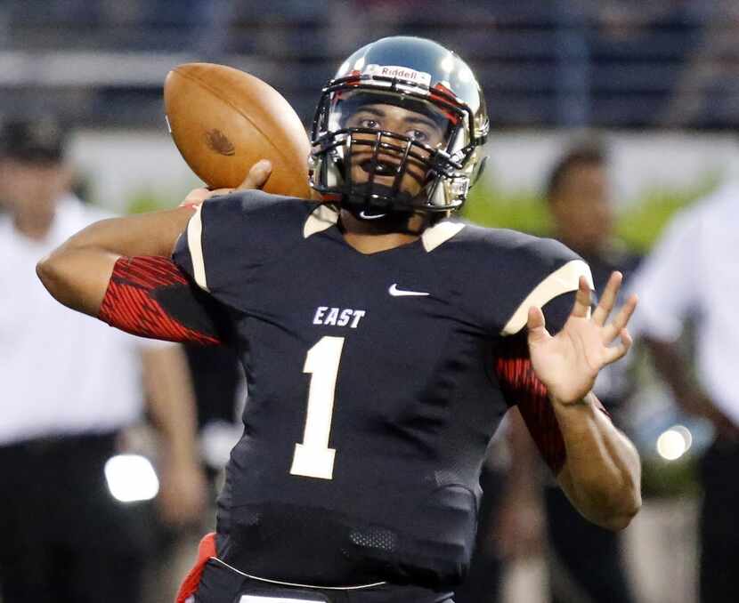 Plano East quarterback Miklo Smalls (1) throws a pass in the first quarter as Plano East...