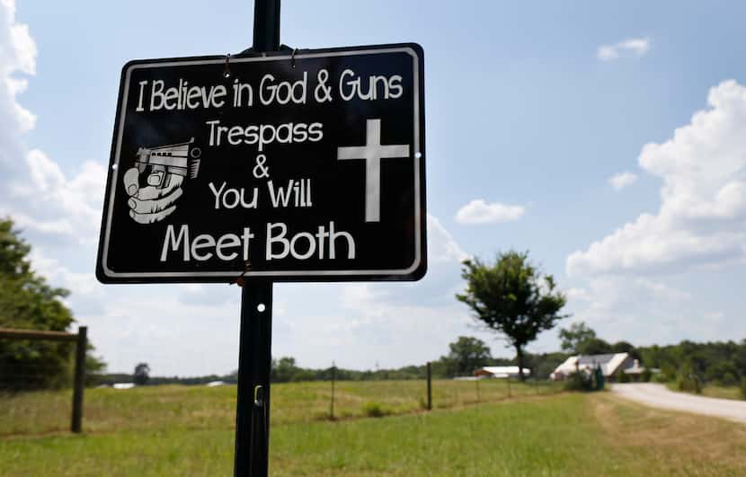 A sign warns trespassers to Linda Good McGillis’ rural Cass County ranch near Marietta,...