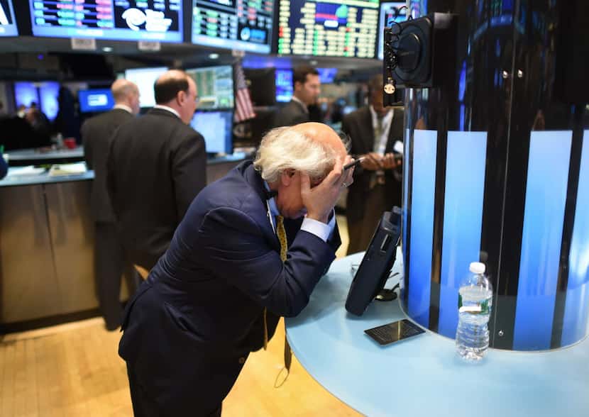 Trader Peter Tuchman takes a breather on the floor of the New York Stock Exchange in New...
