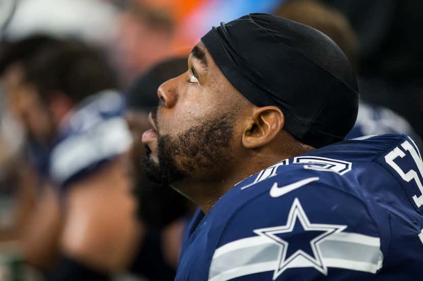 FILE - Dallas Cowboys offensive tackle Tyron Smith (77) looks up from the bench during the...