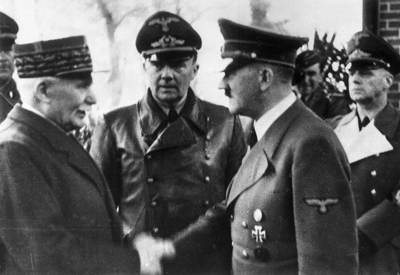 A photo taken Oct. 24, 1940, shows Adolf Hitler (right) shaking hands with Head of State of...
