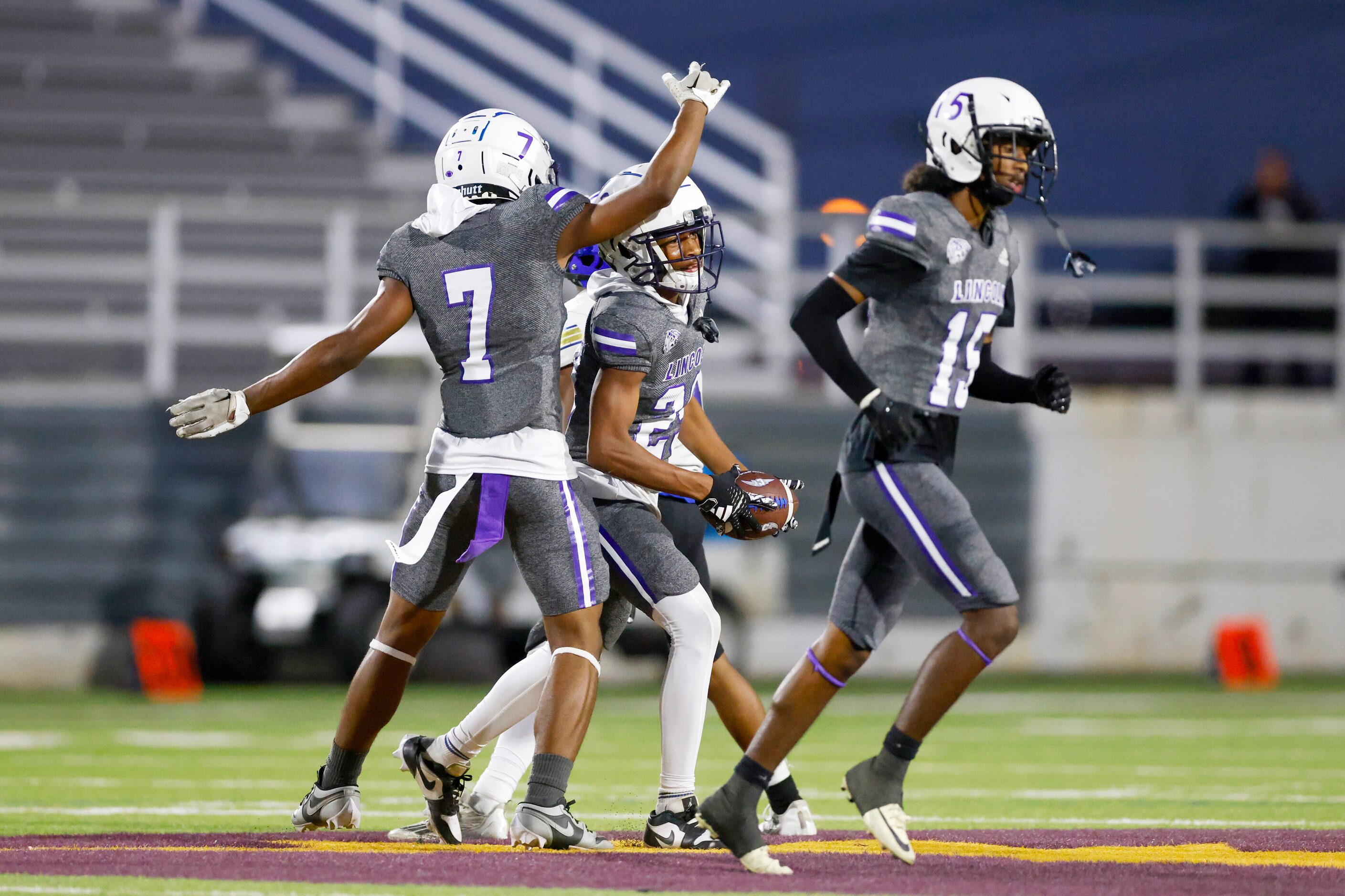 Lincoln defensive back Koron Hill (29) celebrates his interception with defensive back...