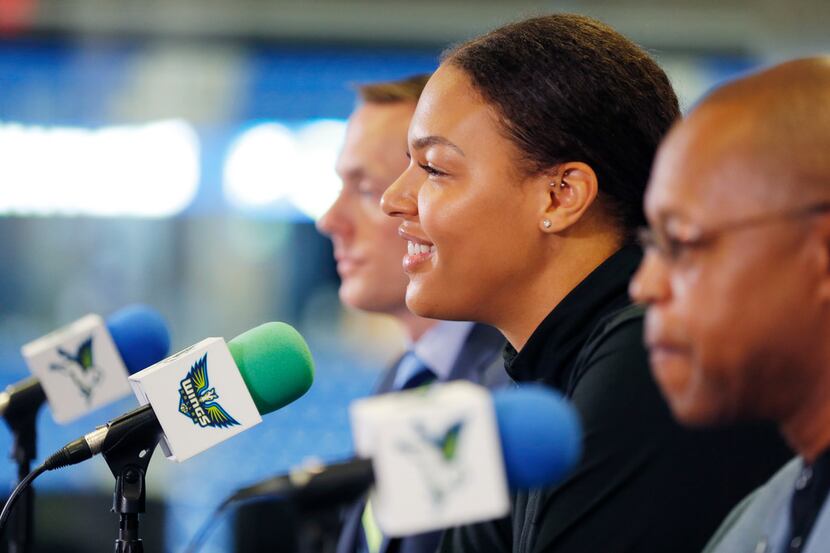 (L to R) Dallas Wings President and CEO Greg Bibb, forward Liz Cambage and head coach Fred...