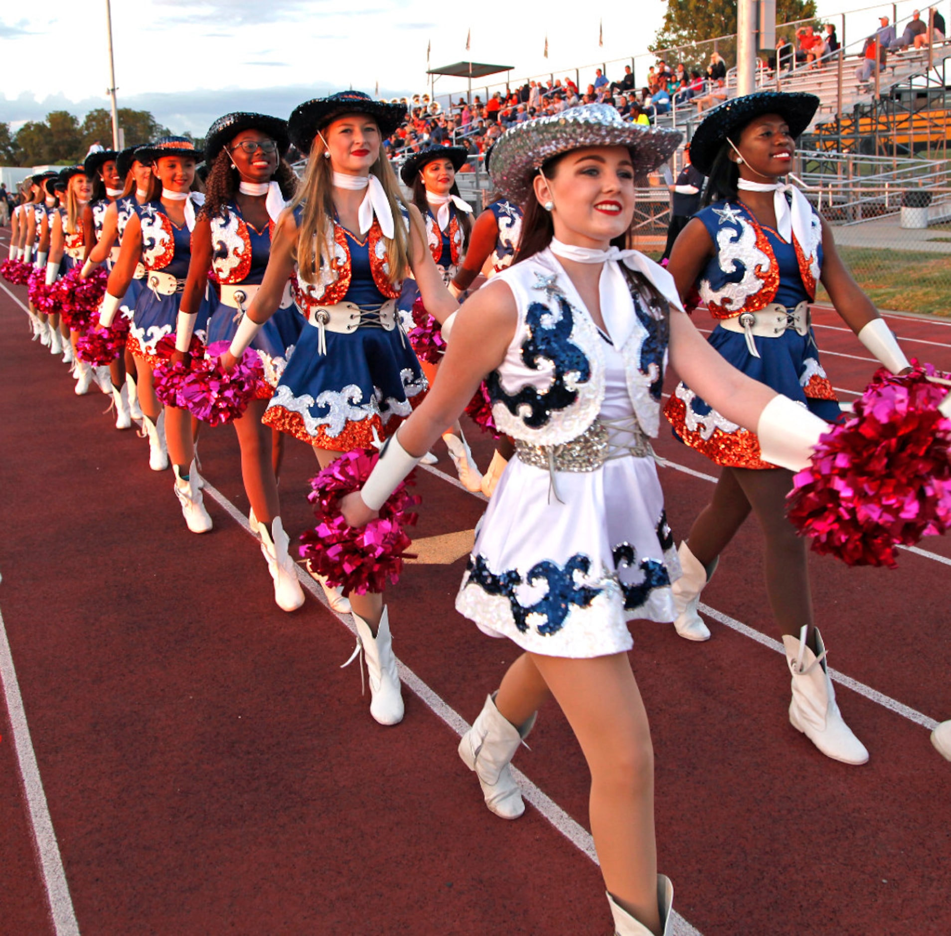 Calli Lustik, 17, a Lt. with the McKinney North High School Northstars, leads the drill team...