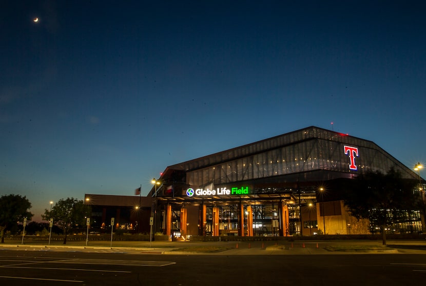 An adjacent parking lot sits empty by Globe Life Field during the opening day game of the...