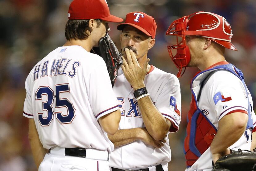 Former Rangers pitching coach Mike Maddux (center) will take his philosophy, his shoulder...