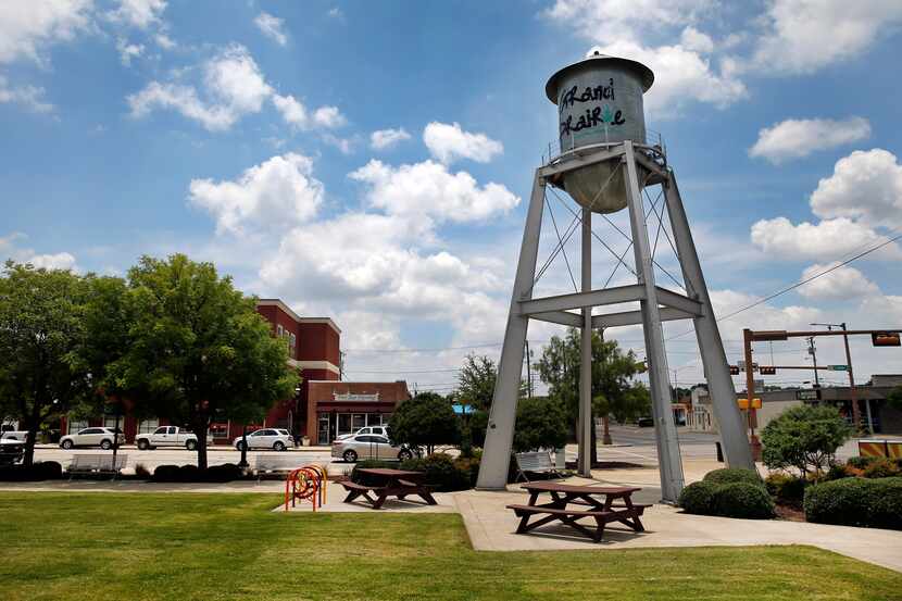 A small water tower stands at the Market Square on Main St. in downtown Grand Prairie.