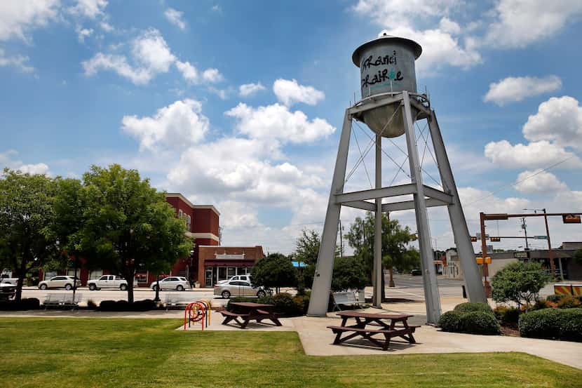 A small water tower stands at the Market Square on Main St. in downtown Grand Prairie,...