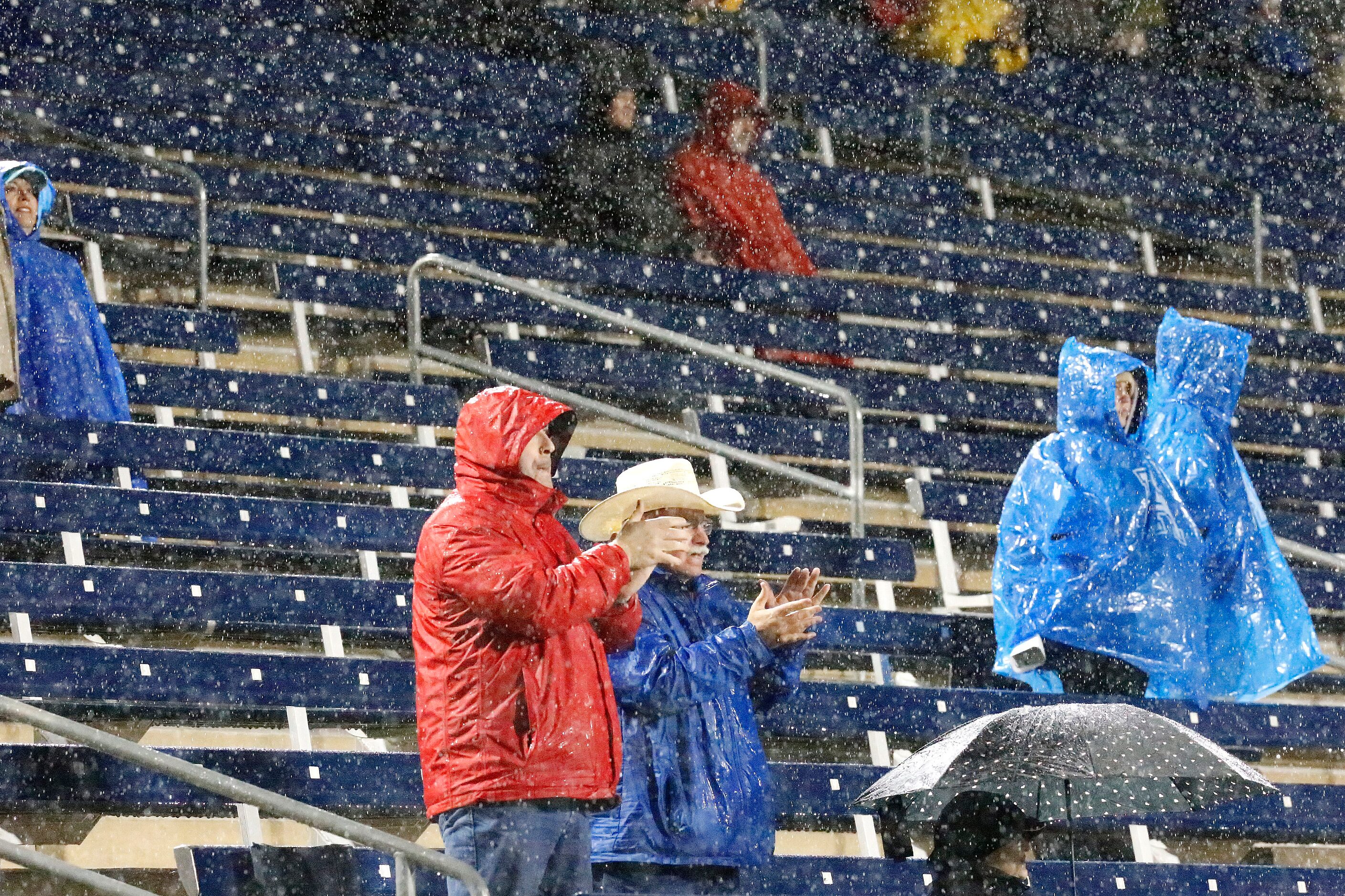 Allen fans at midfield applaud after a touchdown during the first half as Allen High School...