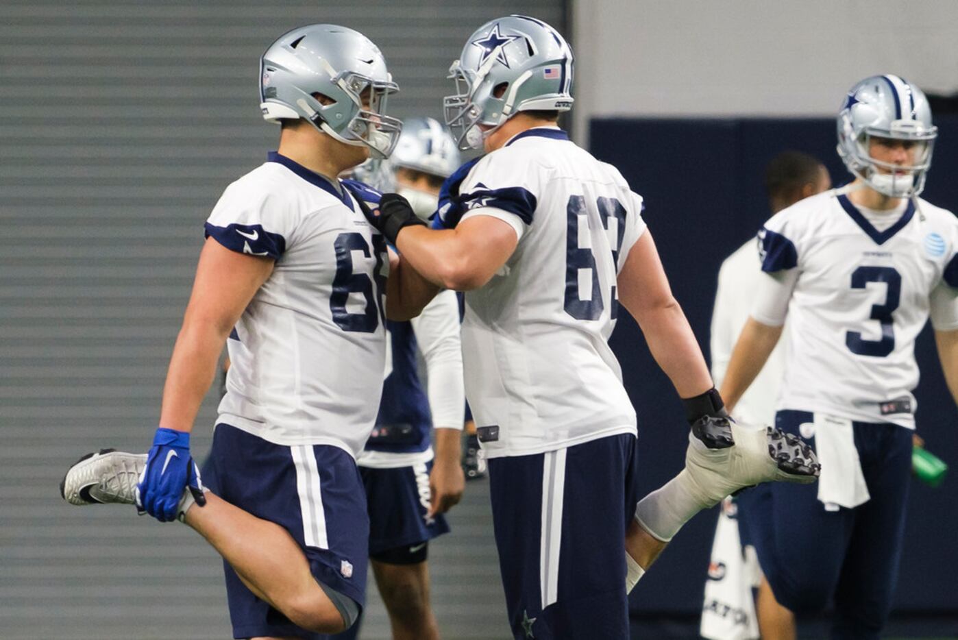 Dallas Cowboys guard Connor McGovern (66) is helped off the field by team  medical staff after suffering an unknown injury in the first half of a NFL  football game against the Tampa