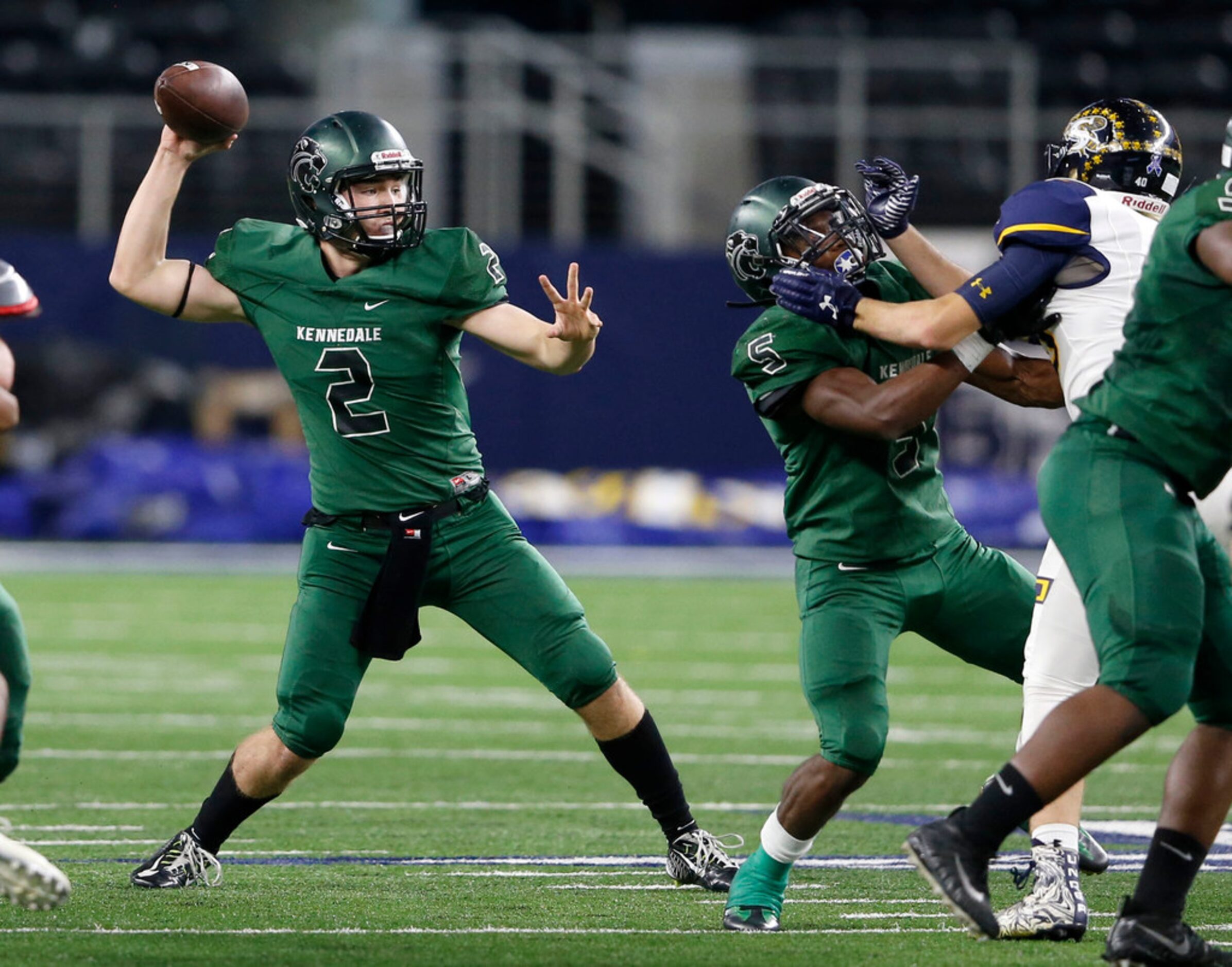 Kennedale's Evan Jowers (2) attempts a pass in a game against Stephenville during the first...