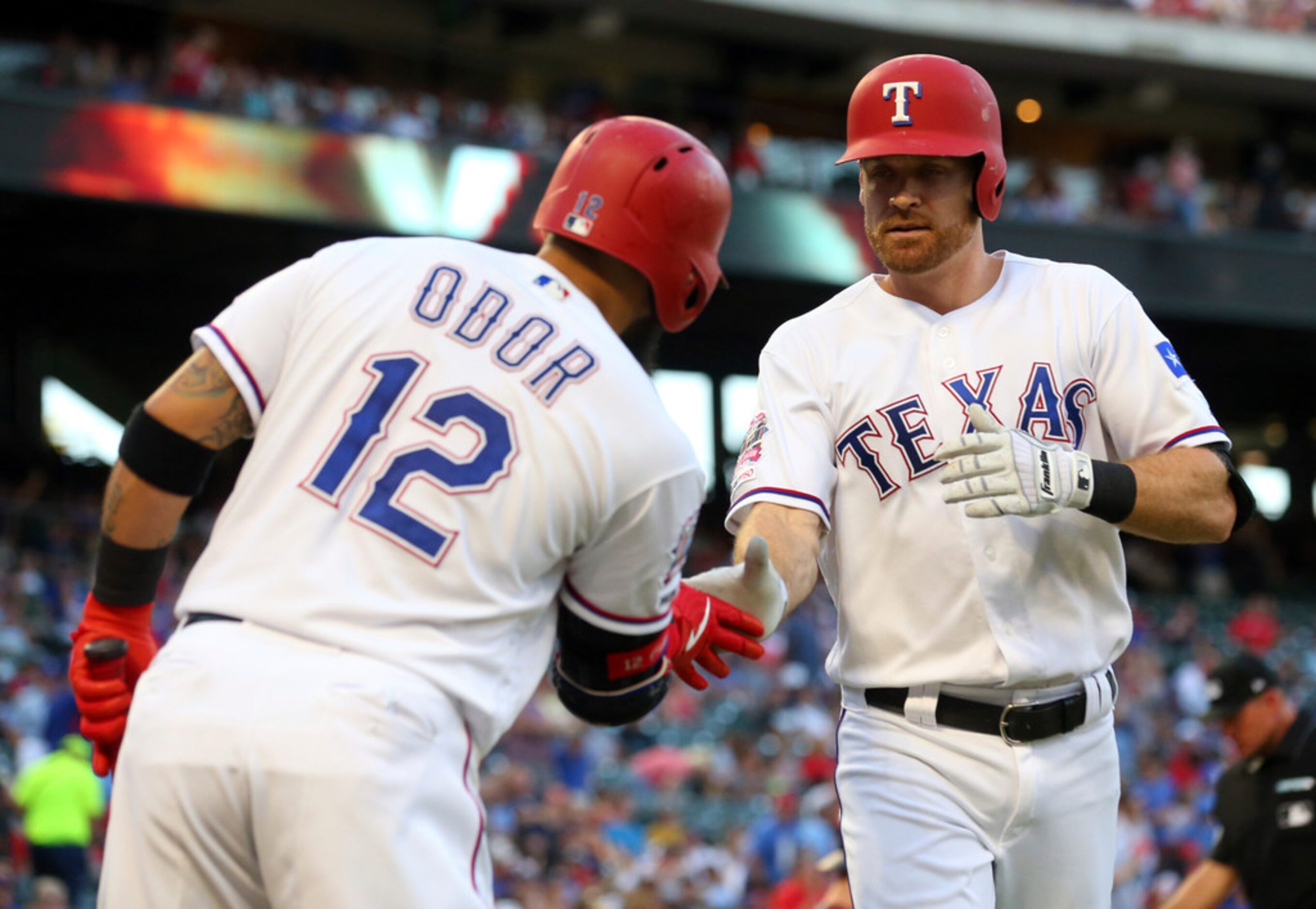 Texas Rangers Rougned Odor (12) celebrates the solo home run by Logan Forsythe (41) against...