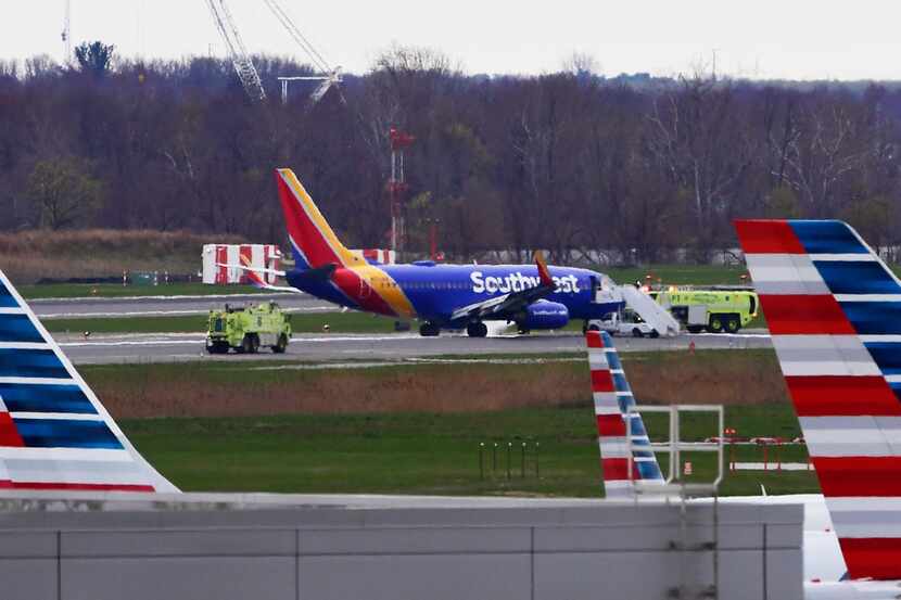 A Southwest Airlines jet sits on the runway at Philadelphia International Airport after it...
