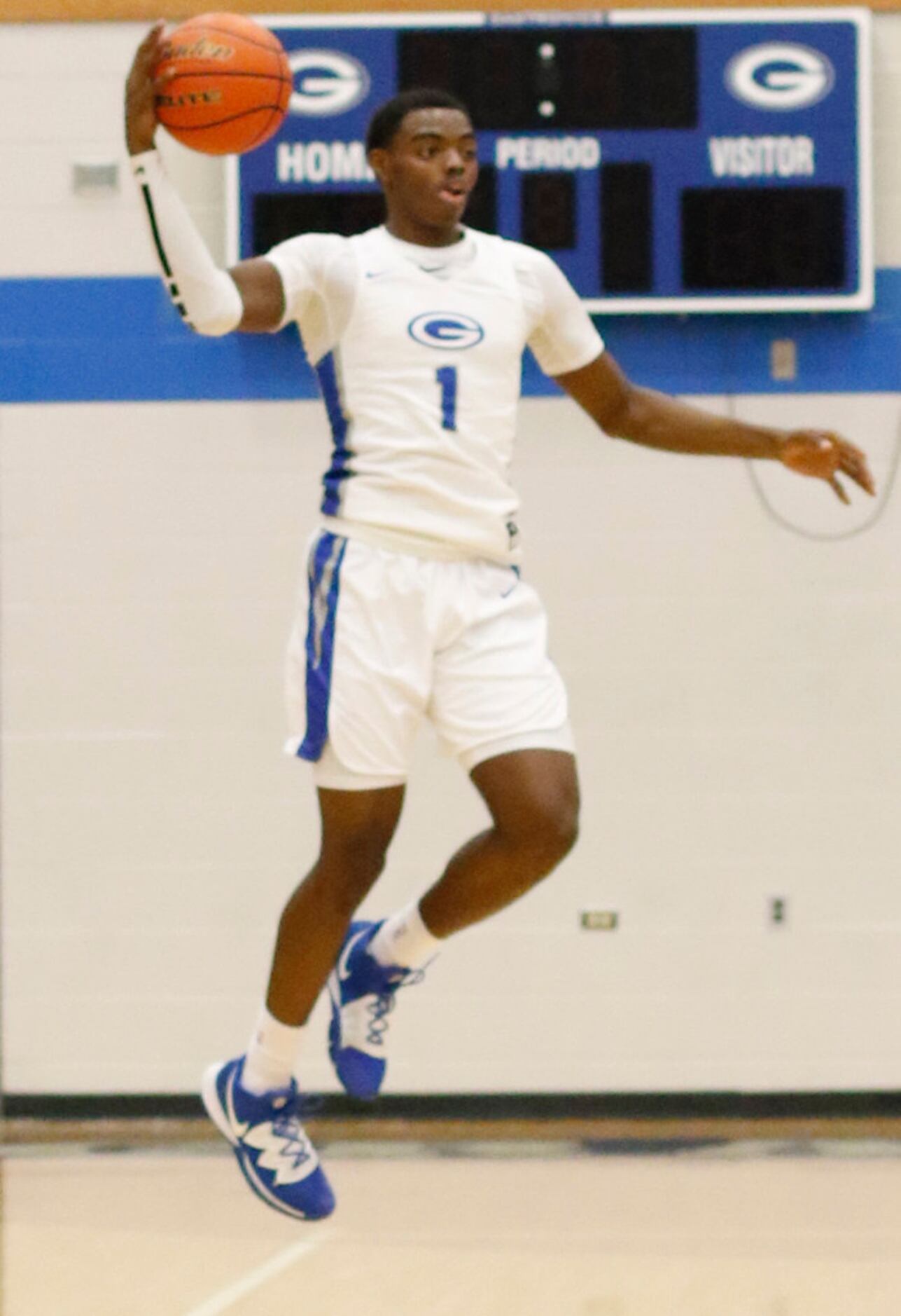 Grand Prairie's Jaylin Posey (1) leaps to pull in a high pass from a teammate during first...