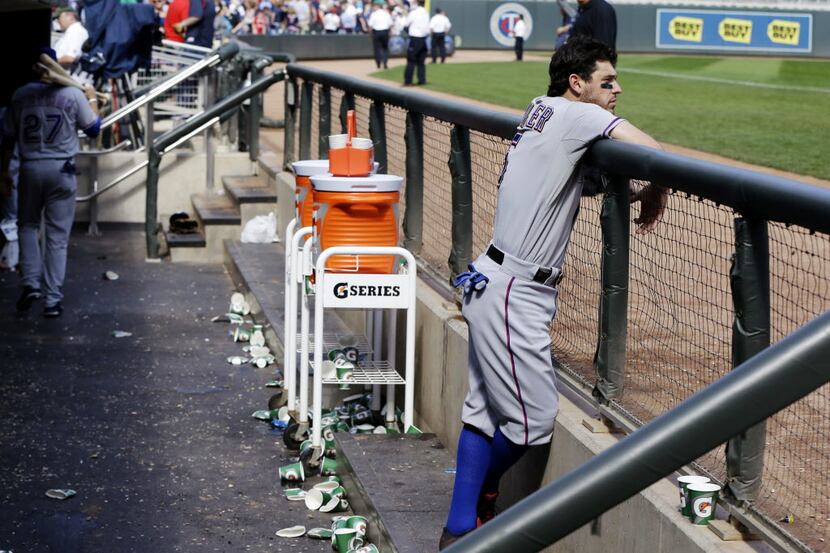 Texas Rangers' Ian Kinsler remains in the dugout after the Minnesota Twins shut out the...