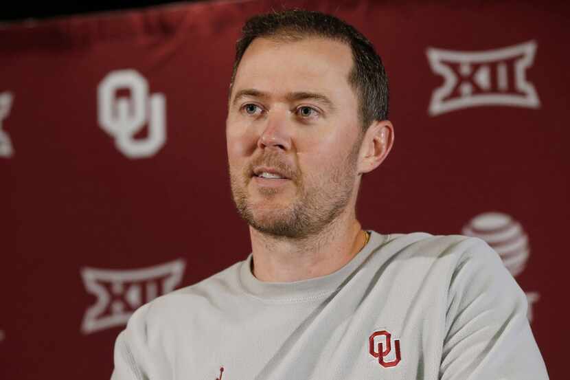 Oklahoma head coach Lincoln Riley answers a question during an NCAA college football news...