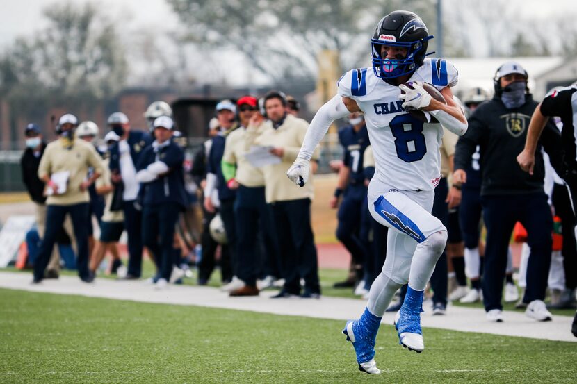 Dallas Christian's Parker Robertson (8) runs in a touchdown against Austin Regents during...