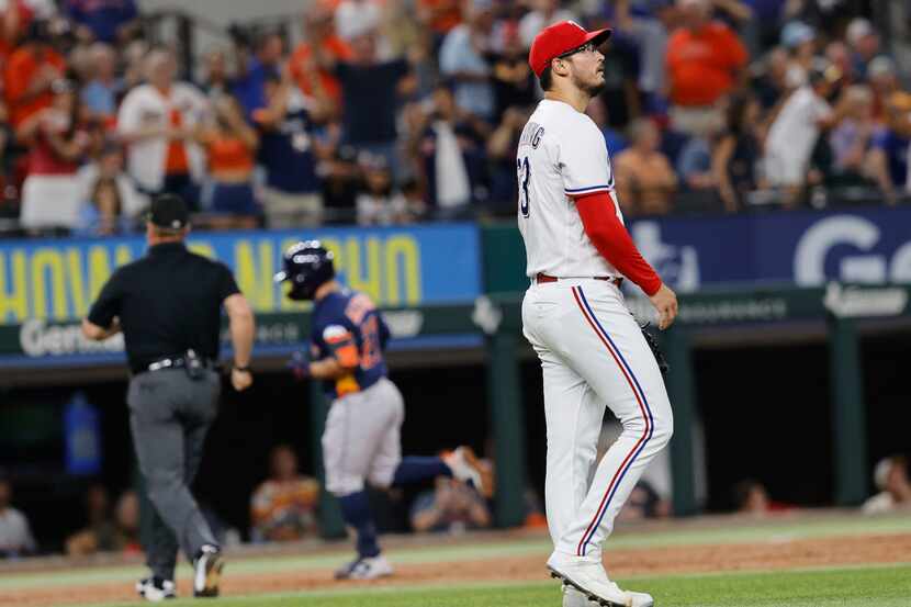 Texas Rangers pitcher Dane Dunning (33) looks away as Houston Astros second baseman Jose...