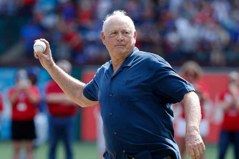 Hall of Fame pitcher Nolan Ryan throws out the ceremonial first pitch before a baseball game...