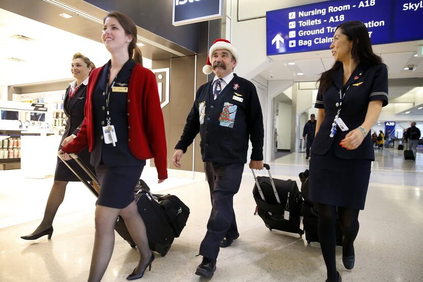 American Airlines Bryan Merton sported a Santa hat as he and fellow flight attendants (from...