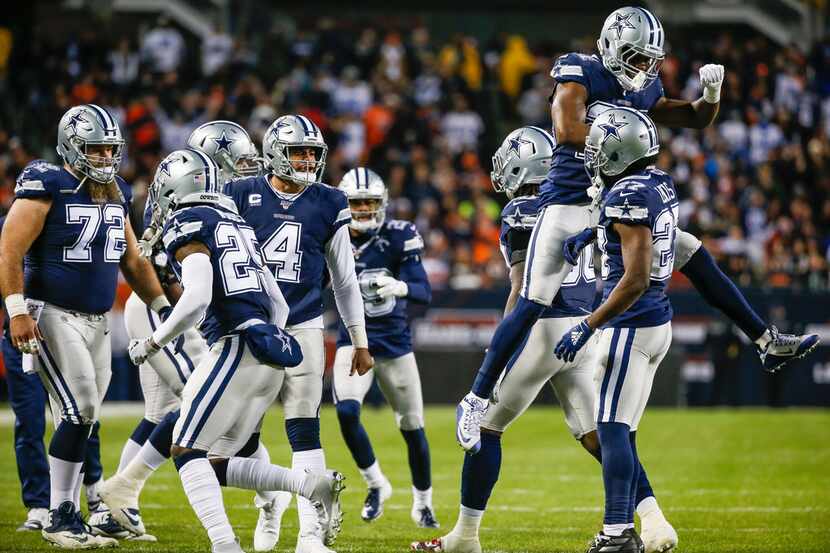 The Dallas Cowboys celebrate an interception by Dallas Cowboys cornerback Jourdan Lewis (27)...