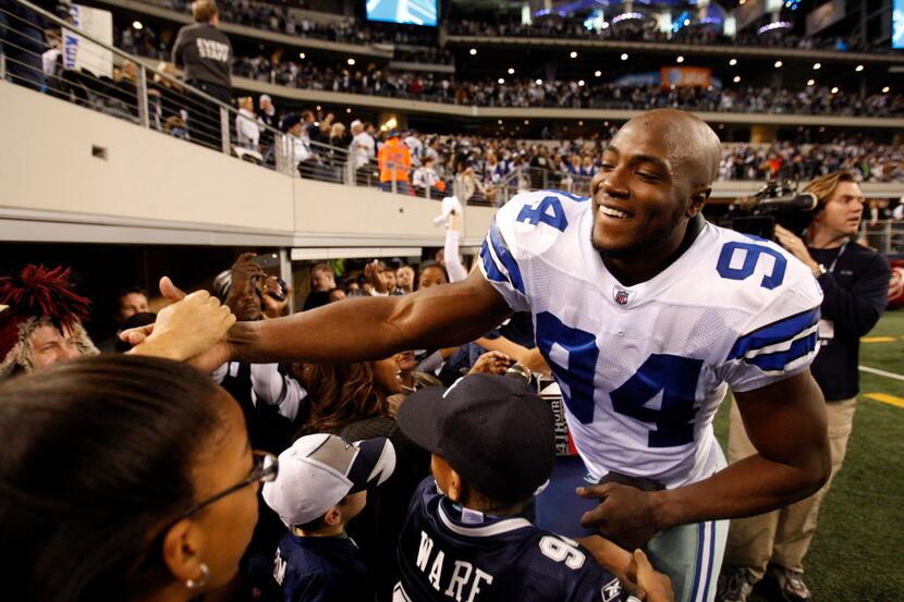 Dallas Cowboys DeMarcus Ware (94) celebrates with fans after defeating the Philadelphia...
