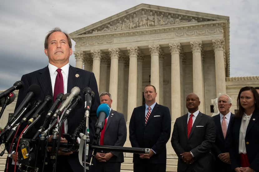 Texas Attorney General Ken Paxton and a bipartisan group of state attorneys general speaks...