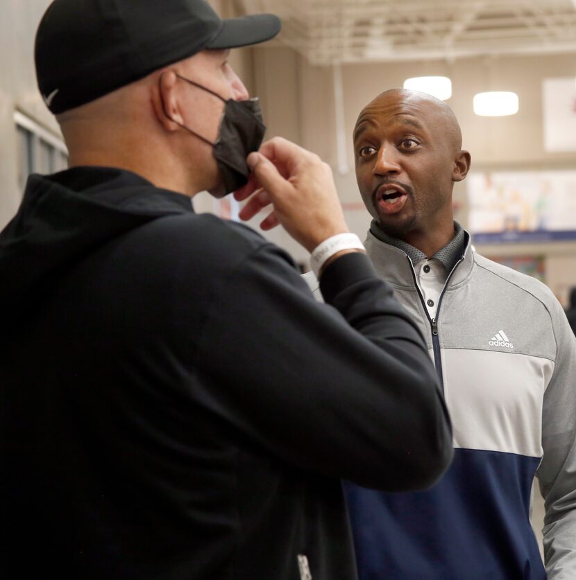 Former Dallas Mavericks teammates Jason Terry, right, and Mavericks head coach Jason Kidd...