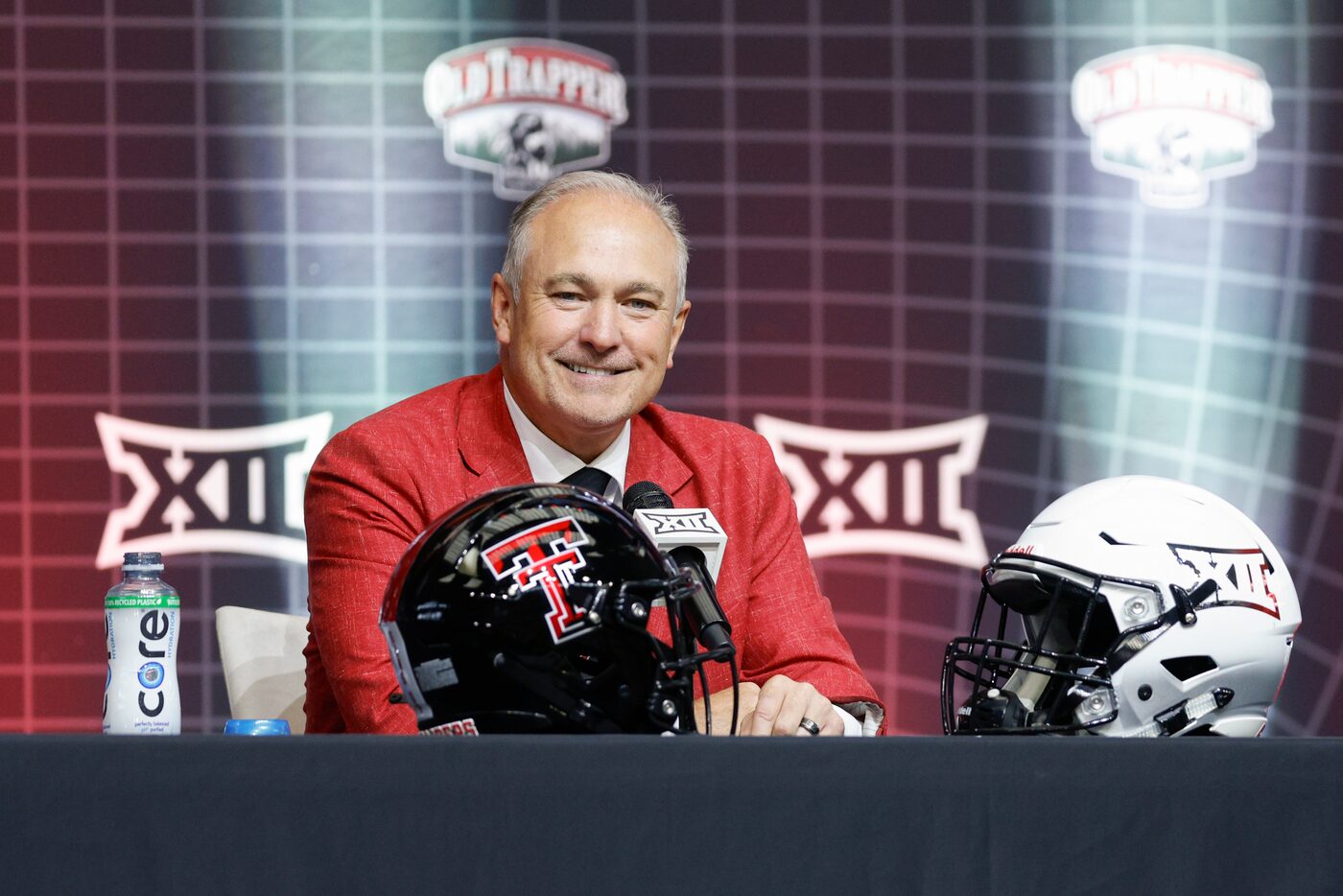 Texas Tech head coach Joey McGuire smiles as he listens to a question during the Big 12...