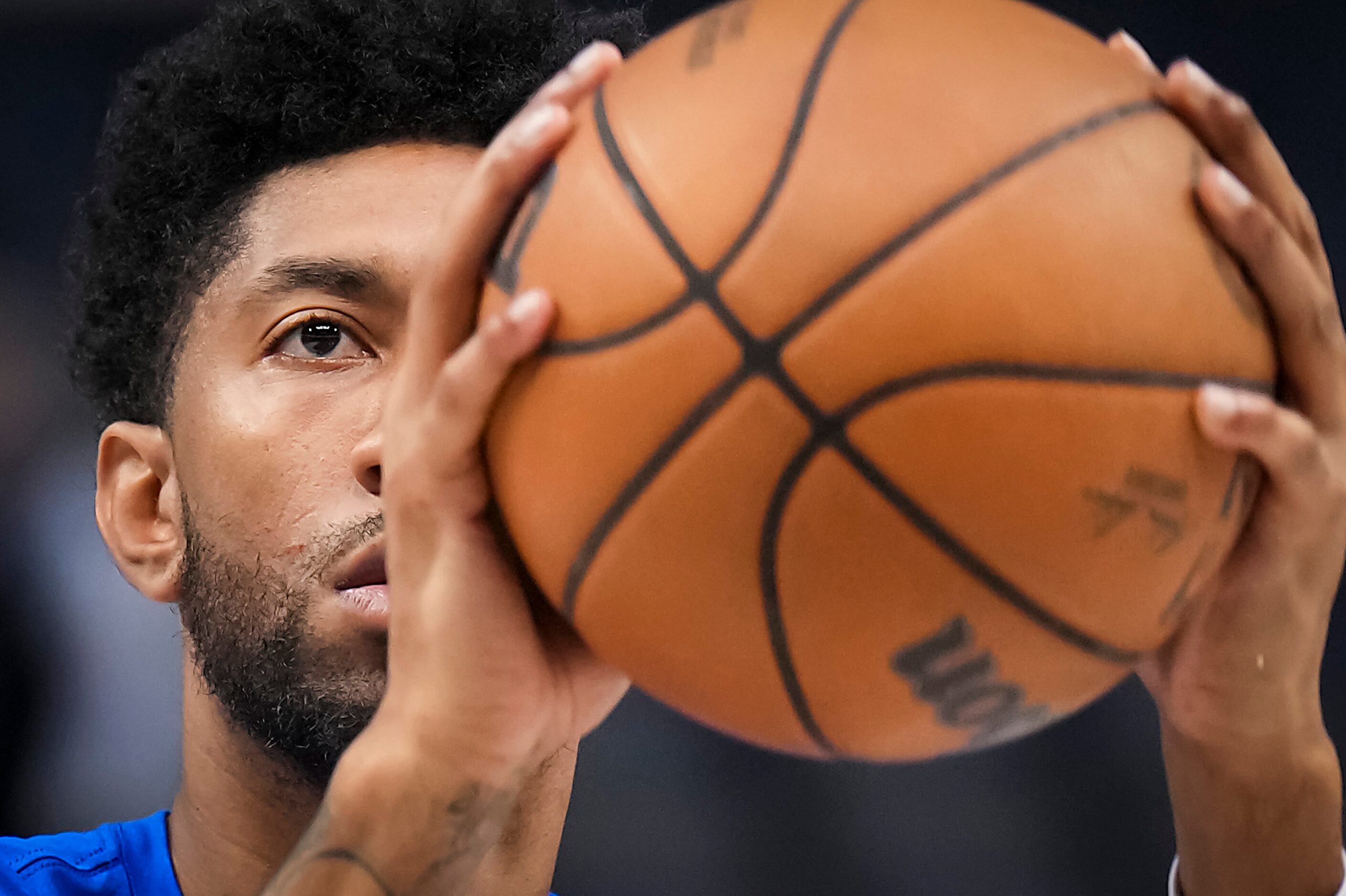 Dallas Mavericks center Christian Wood warms up before an NBA preseason basketball game...