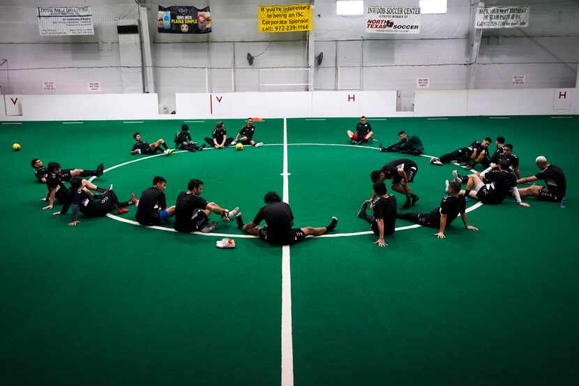 Dallas Sidekicks players stretch after practice at Inwood Soccer Center on Monday, Dec. 16,...