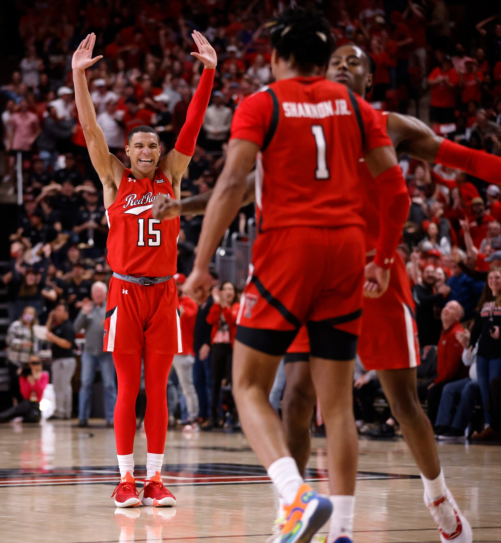 Texas Tech Red Raiders guard Kevin McCullar (15) rects to guard Terrence Shannon Jr.’s (1)...