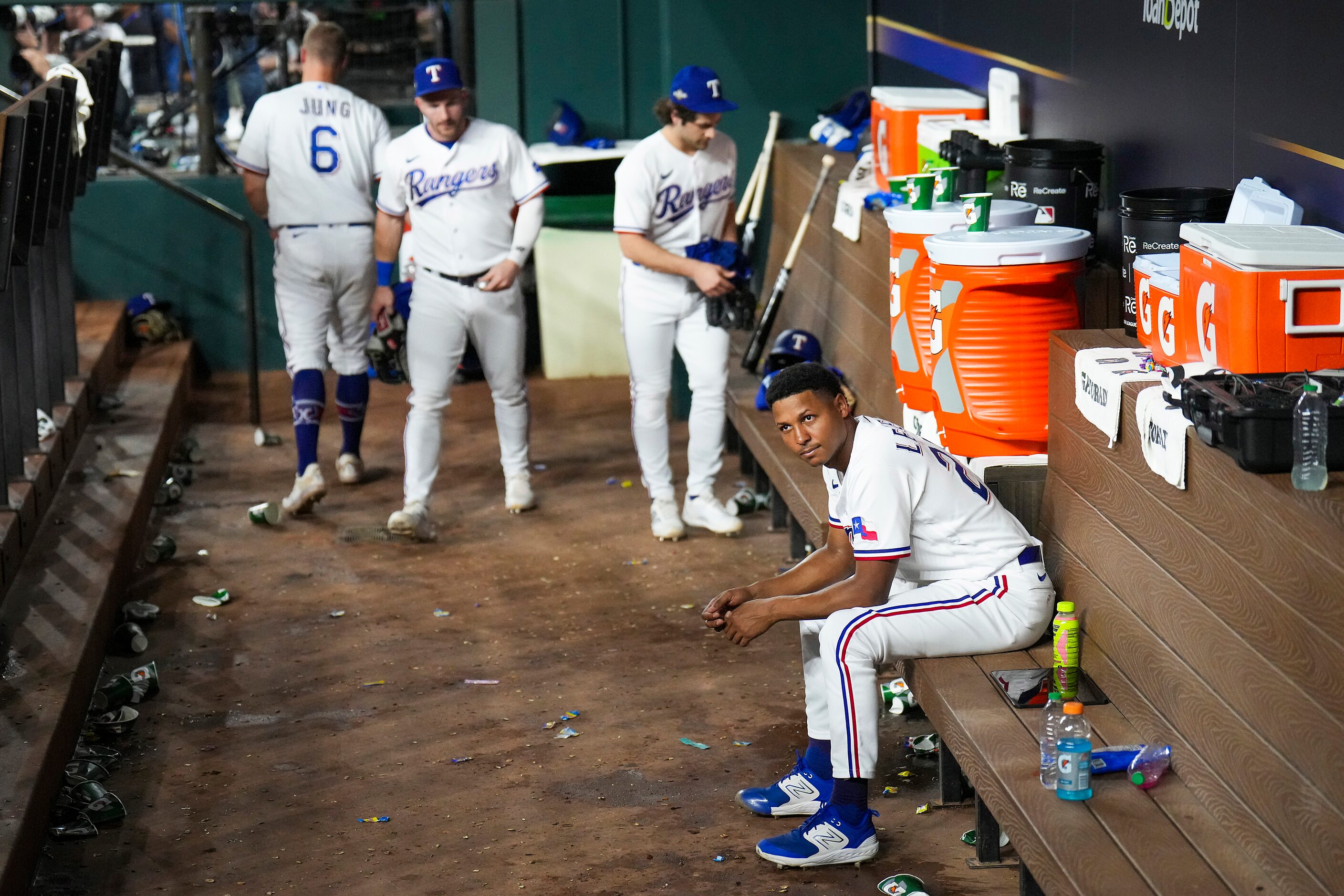 Texas Rangers relief pitcher Jose Leclerc sits in the dugout after a loss to the Houston...