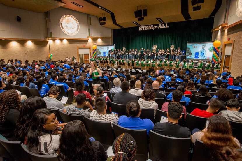 Students participate in a pep rally at Berkner High School celebrating the school district's...