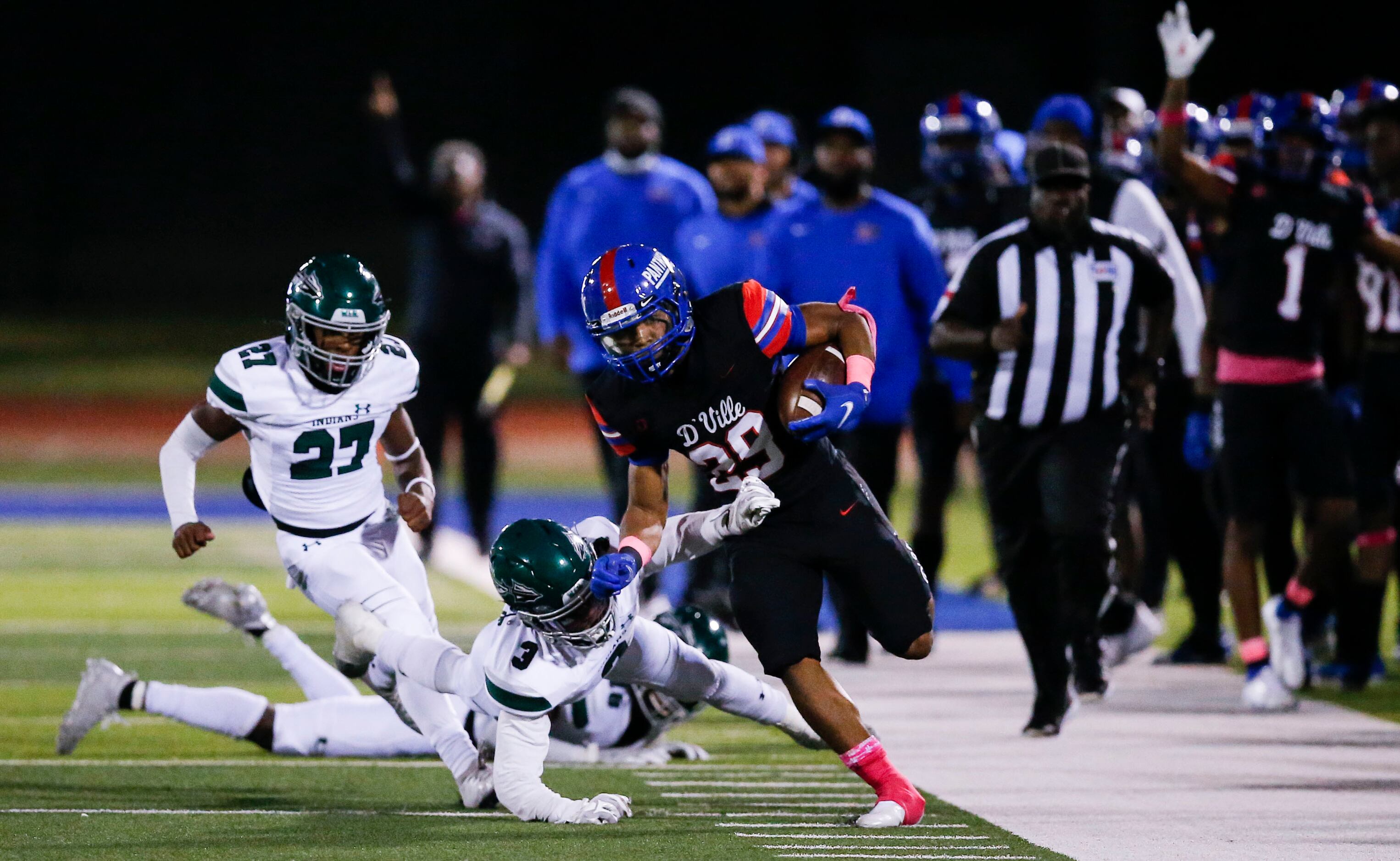 Duncanville sophomore running back Caden Durham (29) is forced out of bound by Waxahachie...