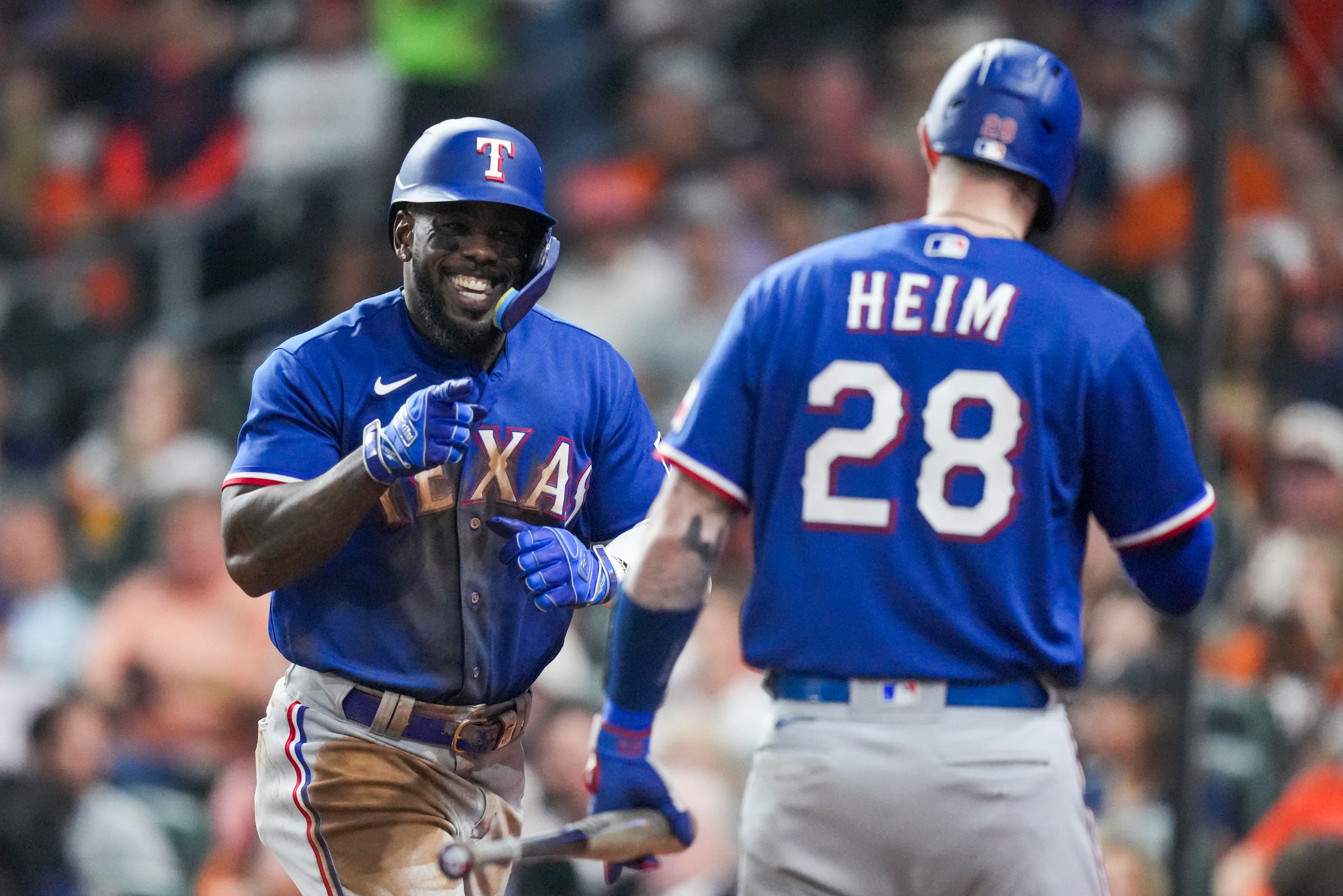 Texas Rangers right fielder Adolis Garcia (53) celebrates with catcher Jonah Heim after...