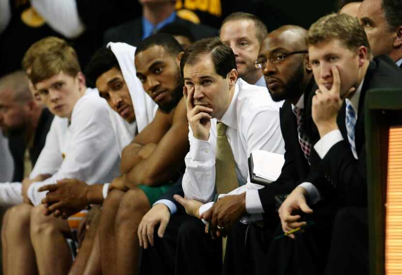Baylor Bears head coach Scott Drew and the bench look on during the second half against the...
