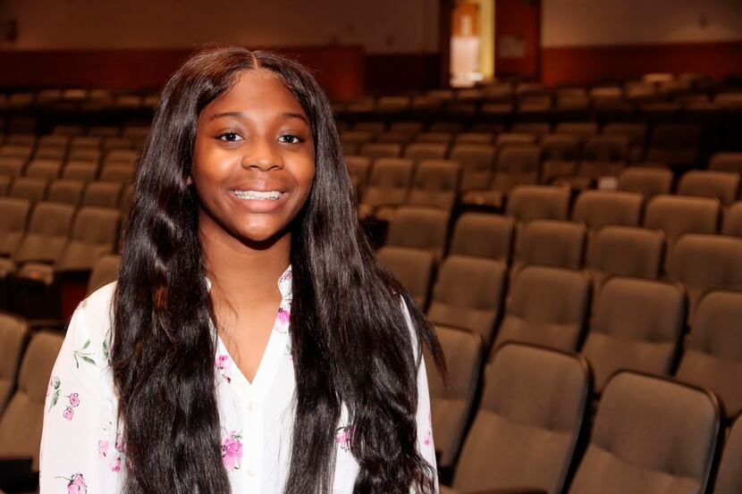 Ladasia Rhone graduated from Arlington High School on Thursday with perfect attendance since...