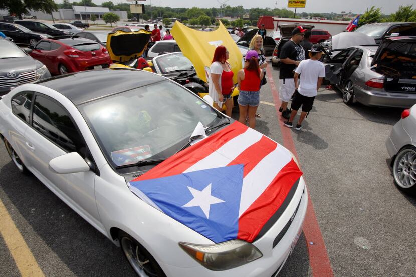 A Puerto Rican flag was displayed on a car during a car show at a Chinchorro party, hosted...